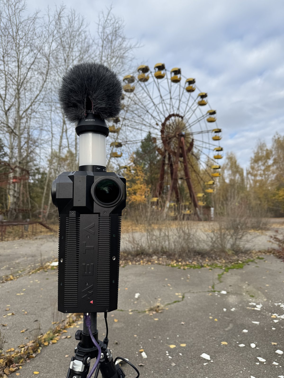 The Meta Three on a tripod in Pripyat, with the abandoned Ferris wheel behind.